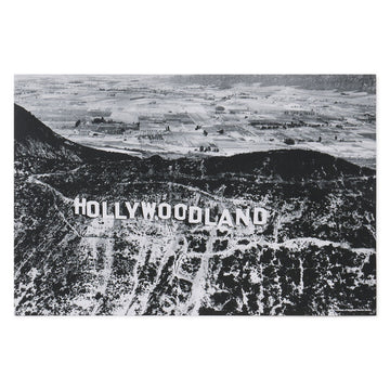 Black and white aerial view of the Hollywood sign with 'HOLLYWOODLAND' text.